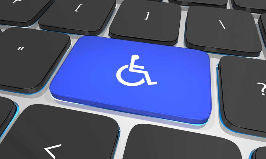 Blue key with a wheelchair on a keyboard